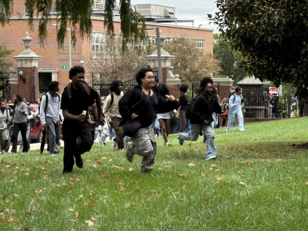 Students running toward the flagpole to gain a visual spot to be in Adamn Killa video. (Photo: Bamidele Aina/HUNewsService.com)