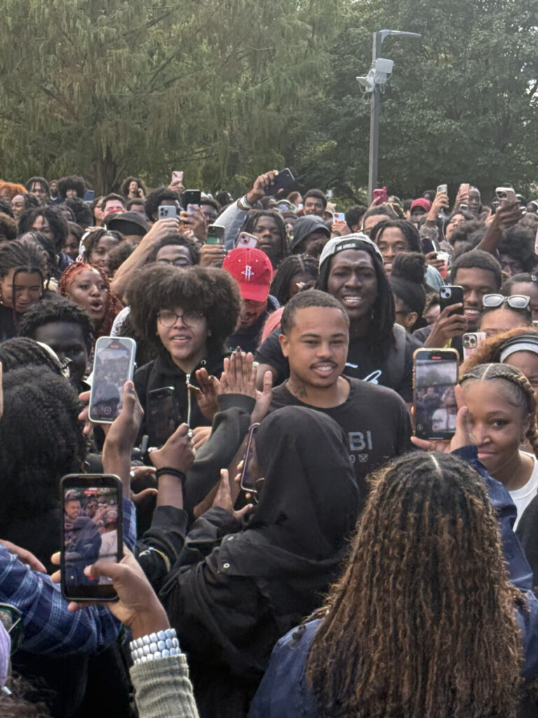 Adamn Killa followed by swarm of students walking onto the Yard. (Photo: Bamidele Aina/HUNewsService.com)