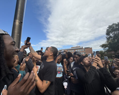 Adamn Killa surrounded by crowd of students at the Flagpole on the Yard. (Photo: Bamidele Aina/HUNewsService.com)
