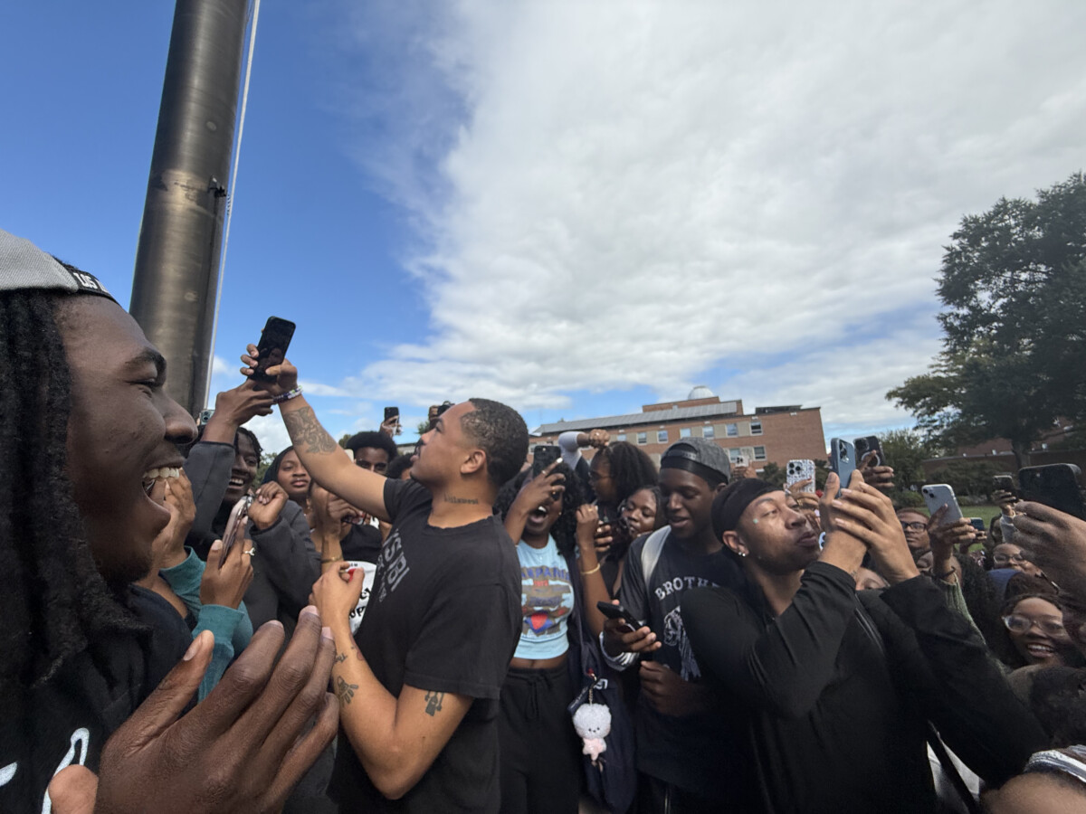 Adamn Killa surrounded by crowd of students at the Flagpole on the Yard. (Photo: Bamidele Aina/HUNewsService.com)