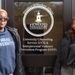 Diandra Blake (left) and Monica Maya (right) stand in front of the door of University Counseling Services. (Tatiana Allen/HUNewsService.com)